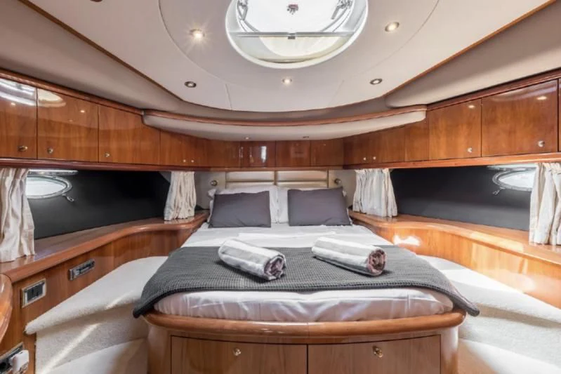 a room with wooden cabinets aboard SKYWATER Yacht for Sale