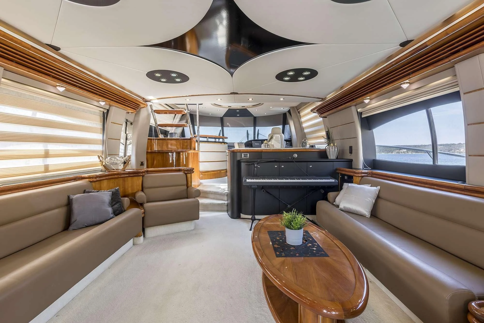 a living room with a piano aboard SKYWATER Yacht for Sale