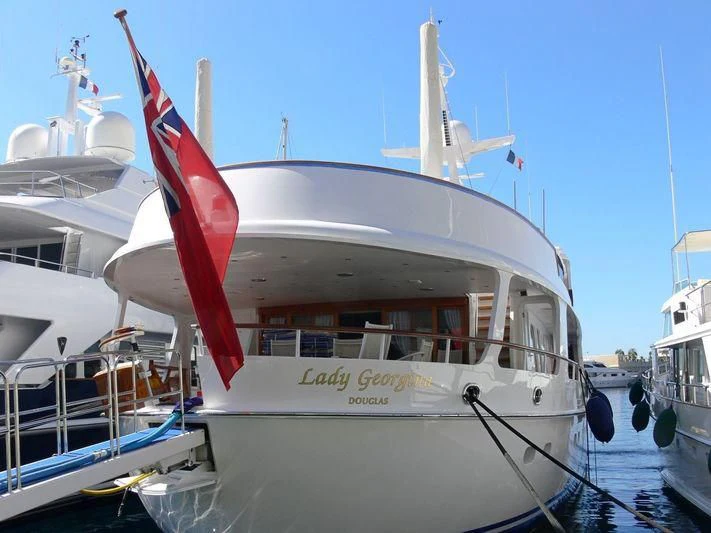 a boat with a flag on the front aboard LADY GEORGINA Yacht for Sale
