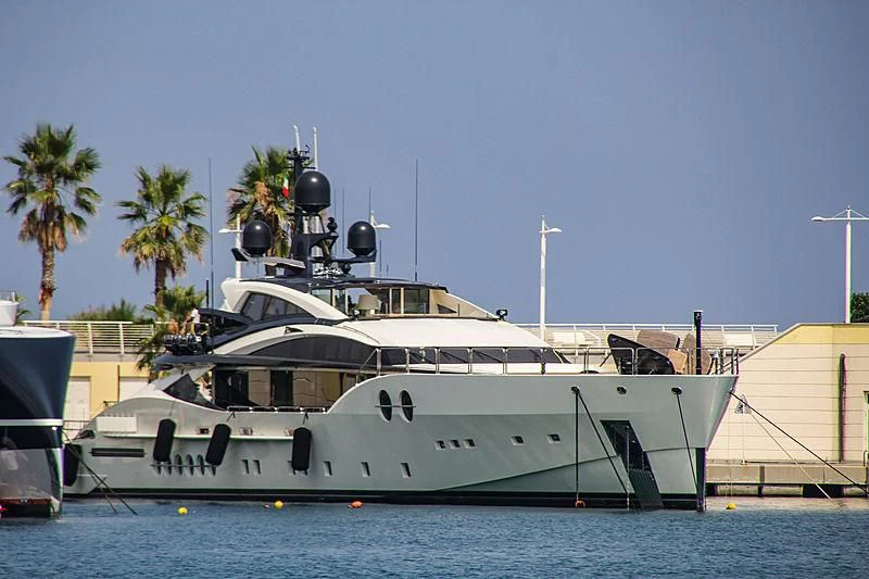 a boat docked at a pier aboard BLISS Yacht for Sale