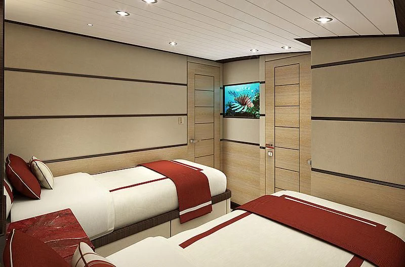 a room with two beds aboard III AMIGOS Yacht for Sale