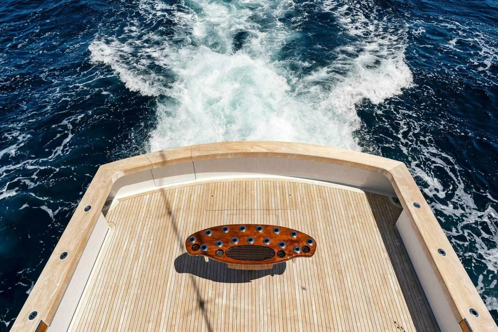 a boat with a circular object on it aboard III AMIGOS Yacht for Sale
