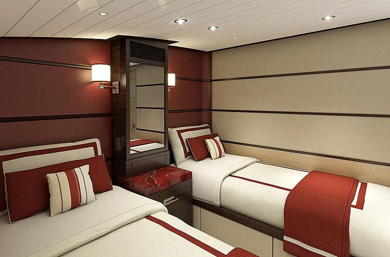 a room with beds and a mirror aboard III AMIGOS Yacht for Sale