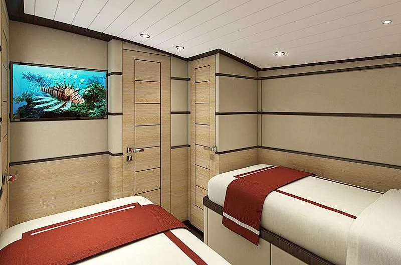 a room with a bed and a tv aboard III AMIGOS Yacht for Sale