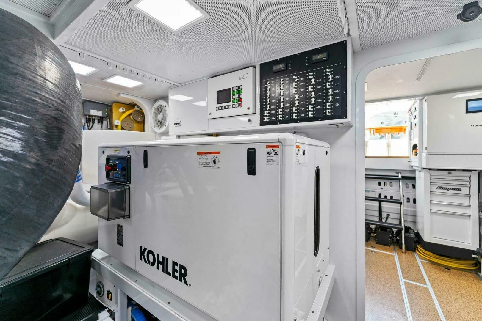 a machine in a room aboard III AMIGOS Yacht for Sale