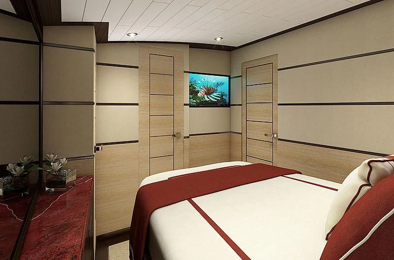 a room with a tv and a bed aboard III AMIGOS Yacht for Sale