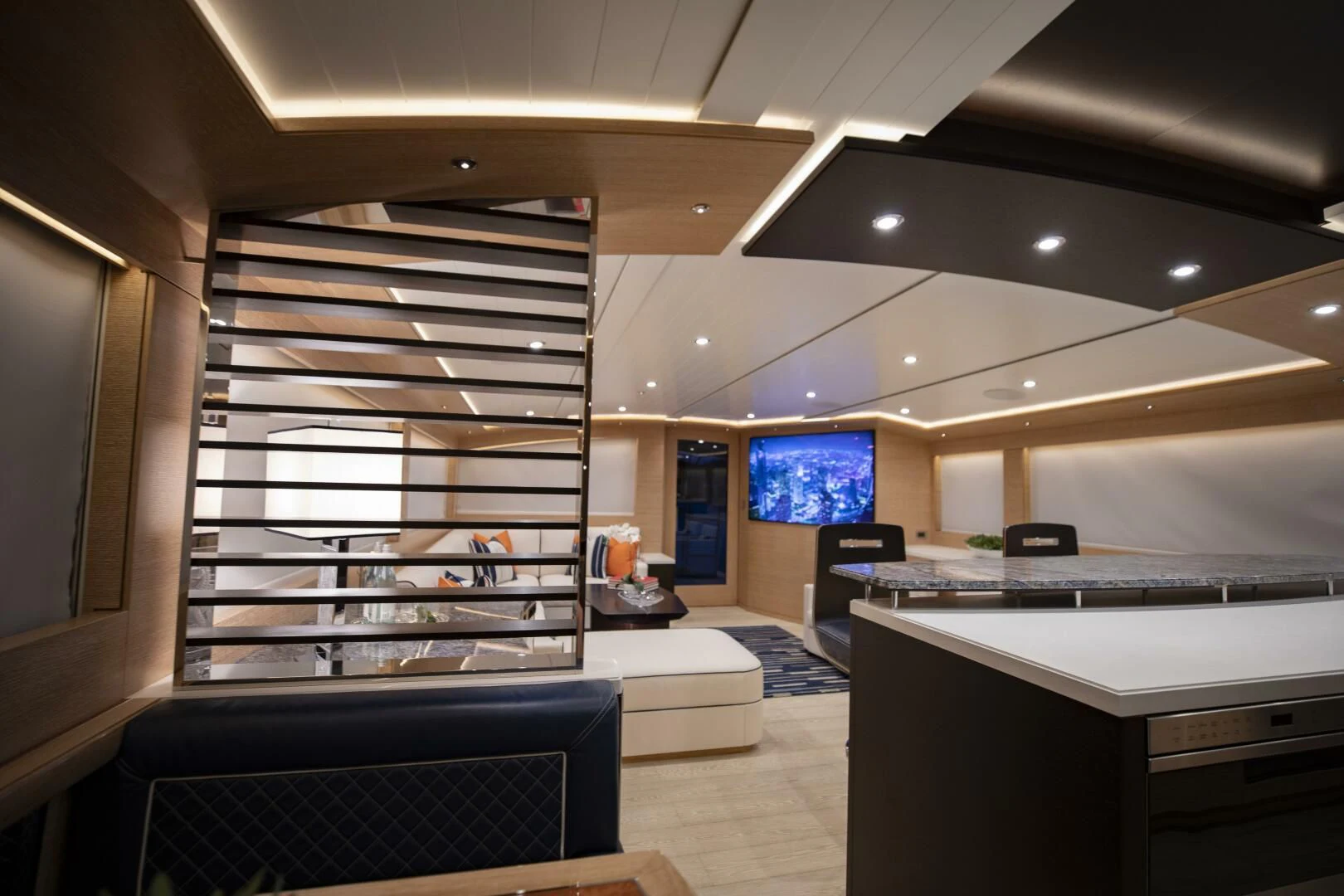 a room with a tv and a couch aboard III AMIGOS Yacht for Sale