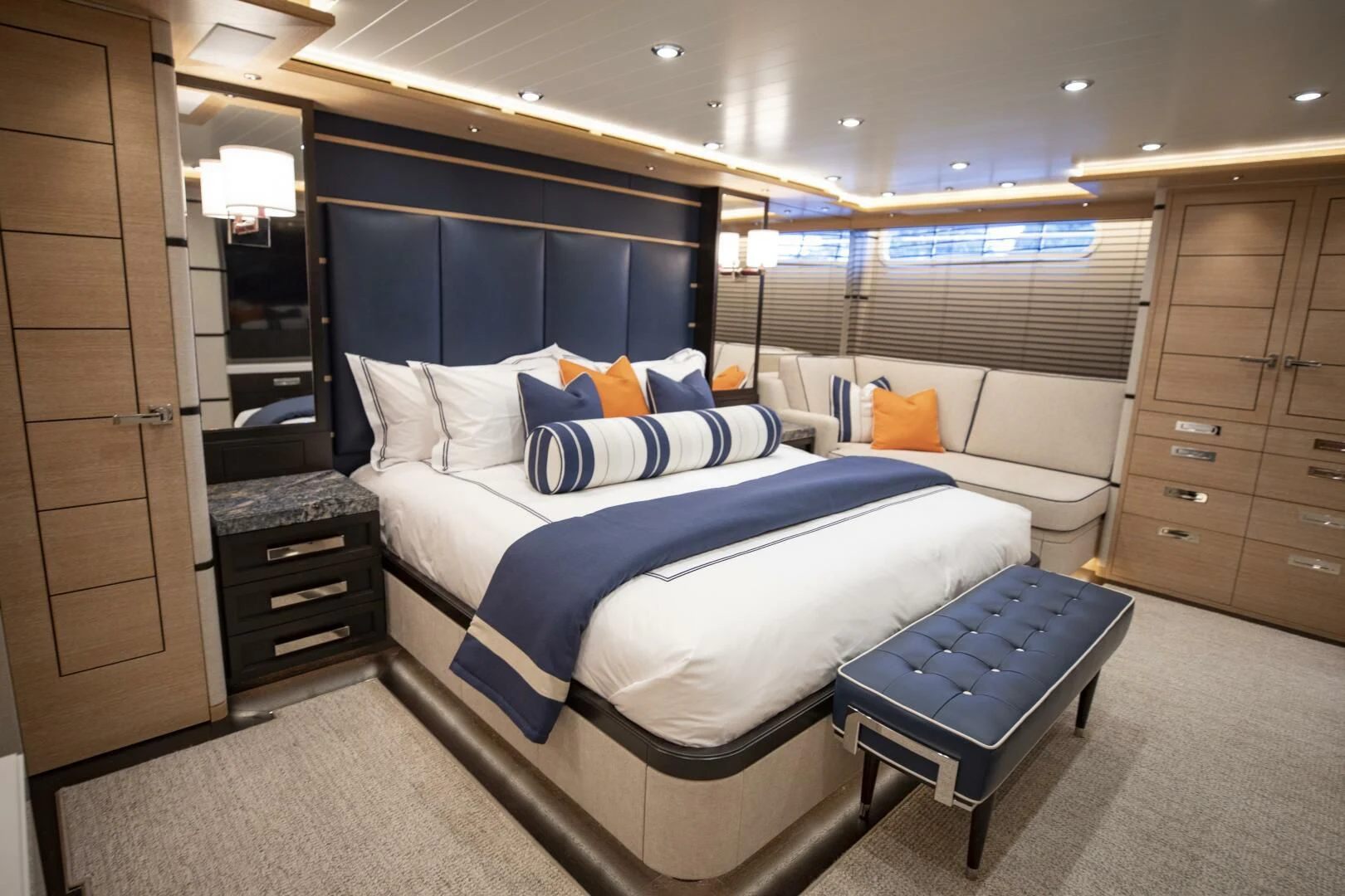 a room with a bed and a couch aboard III AMIGOS Yacht for Sale
