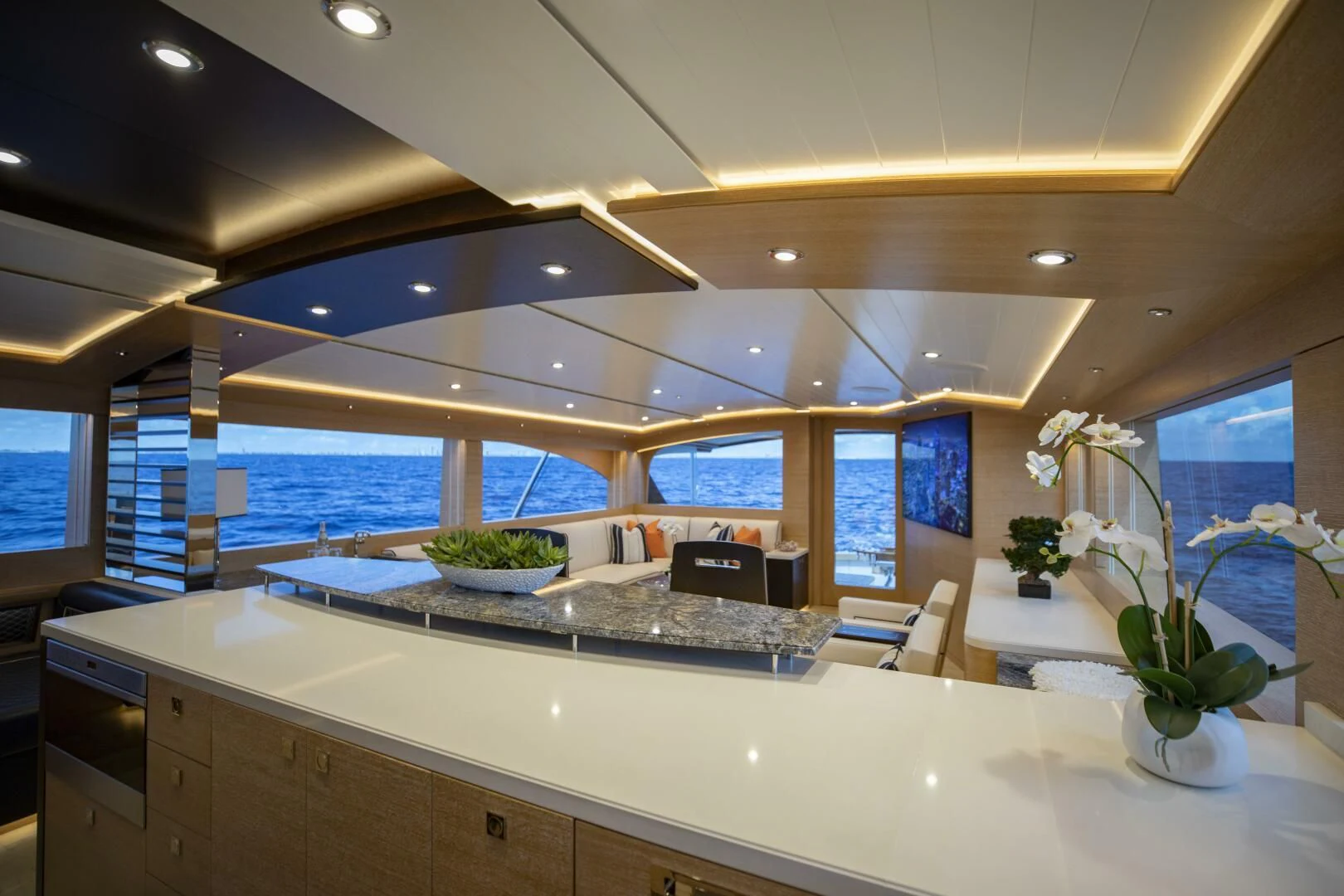 a large kitchen with a large island aboard III AMIGOS Yacht for Sale