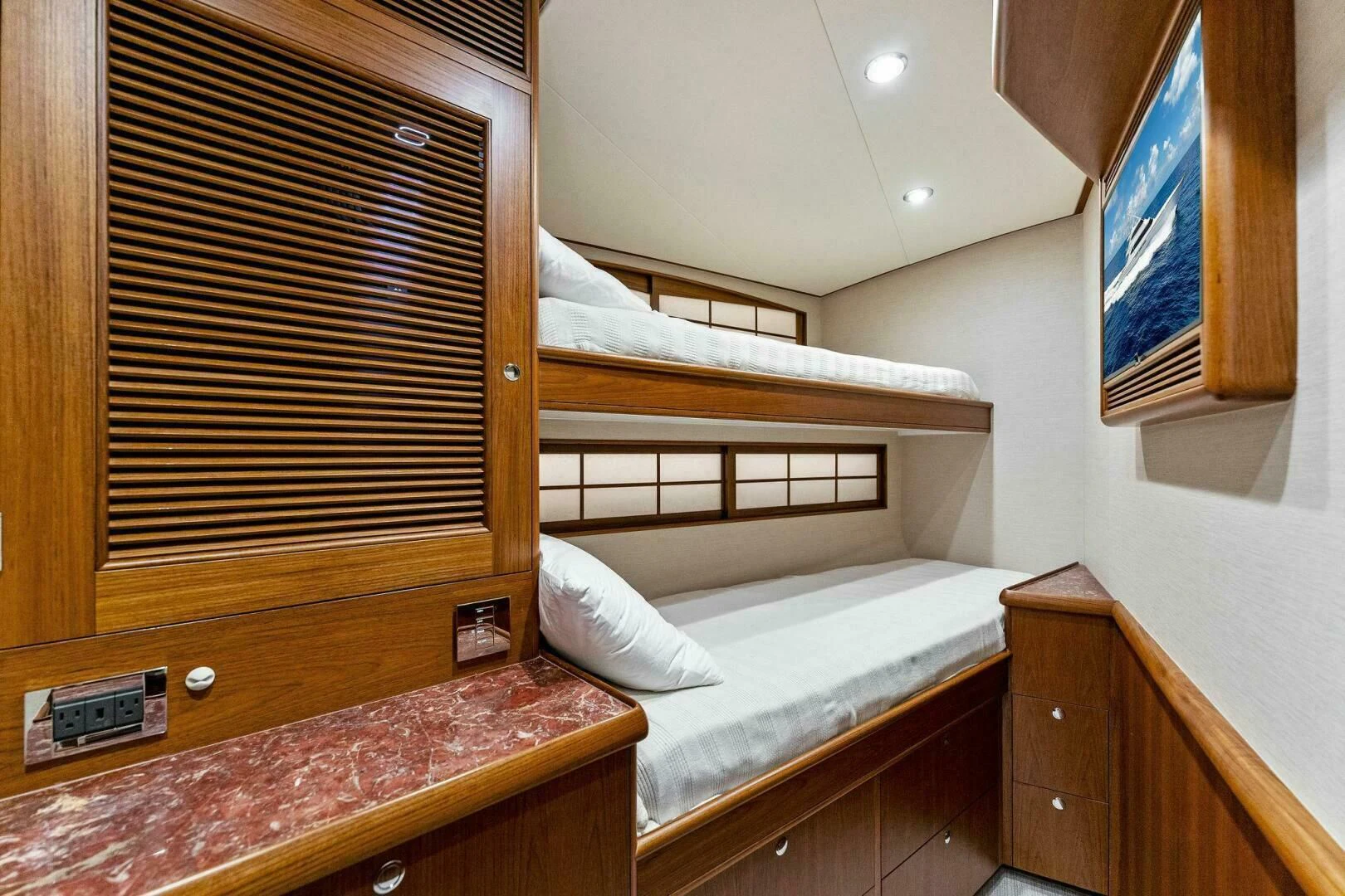 a room with bunk beds aboard III AMIGOS Yacht for Sale