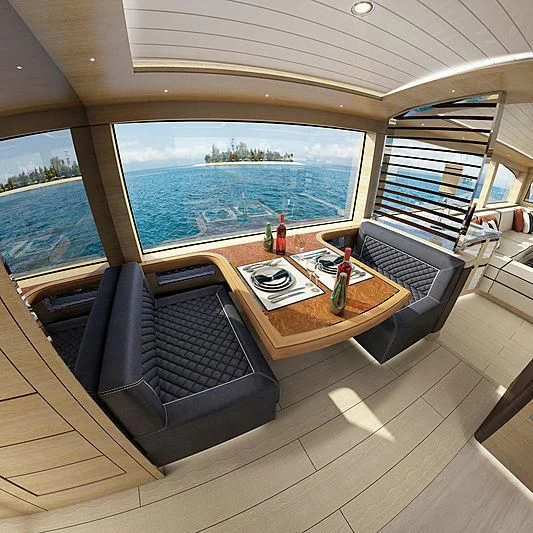 a table with chairs on it next to a large body of water aboard III AMIGOS Yacht for Sale