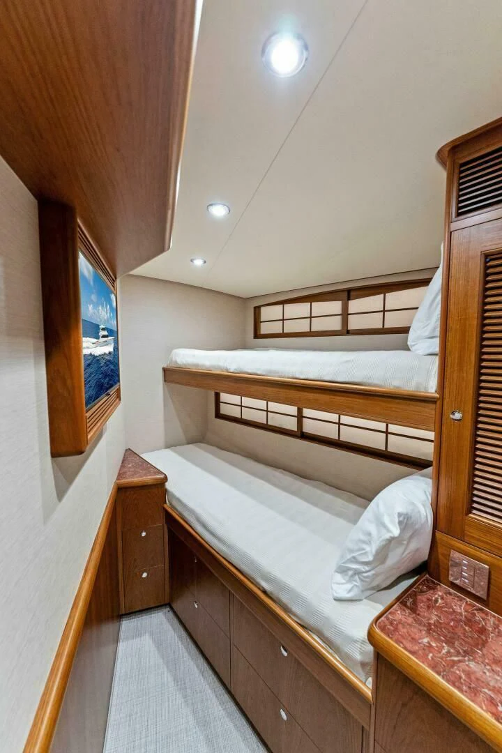 a room with bunk beds aboard III AMIGOS Yacht for Sale