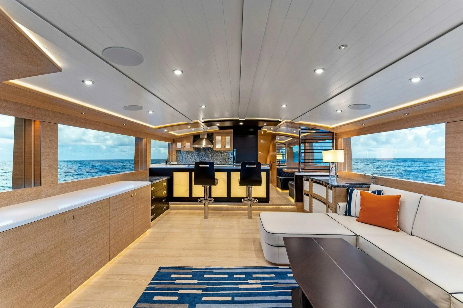 a room with a bed and a table aboard III AMIGOS Yacht for Sale