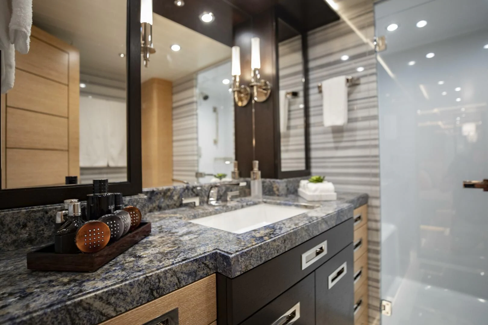 a bathroom with marble counter tops aboard III AMIGOS Yacht for Sale
