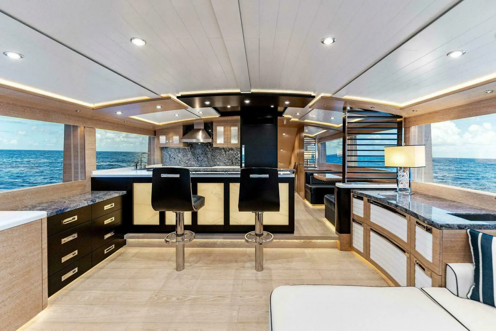 a room with a table and chairs aboard III AMIGOS Yacht for Sale
