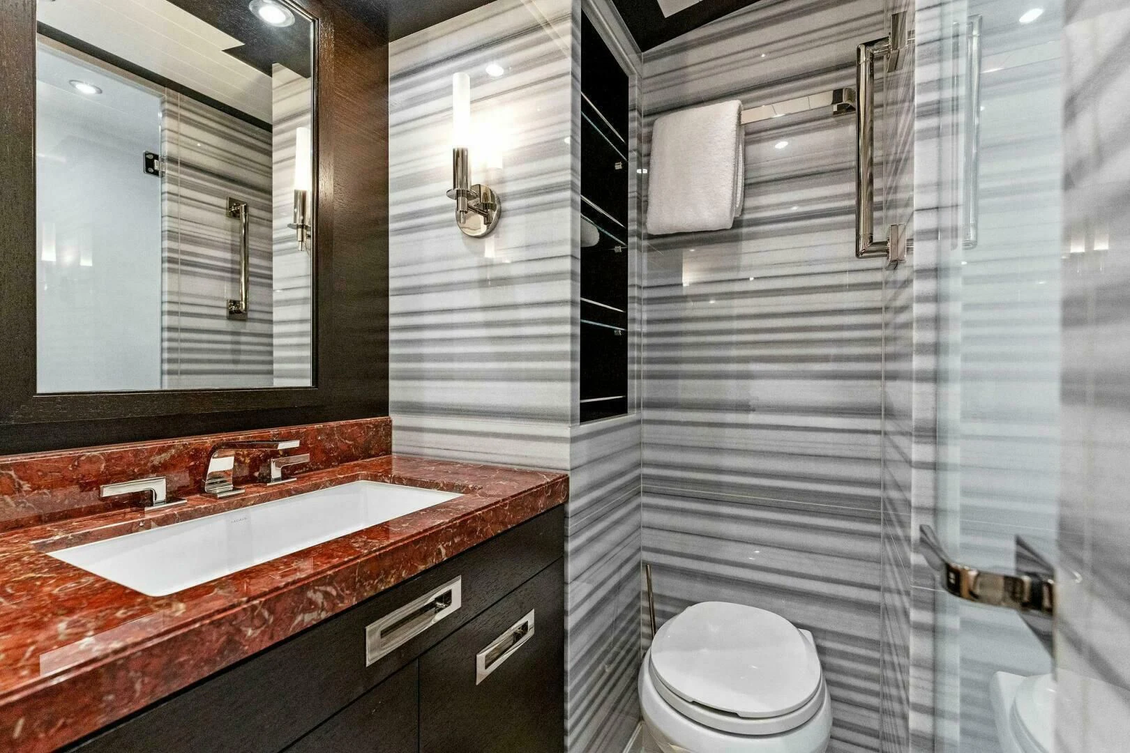 a bathroom with a sink and a toilet aboard III AMIGOS Yacht for Sale
