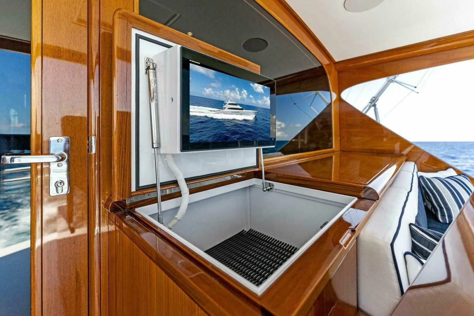 a boat with a window aboard III AMIGOS Yacht for Sale