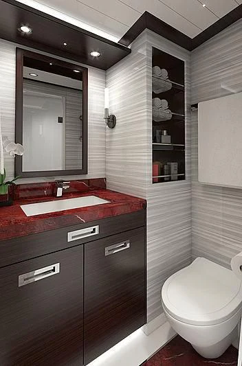 a bathroom with a sink and a toilet aboard III AMIGOS Yacht for Sale