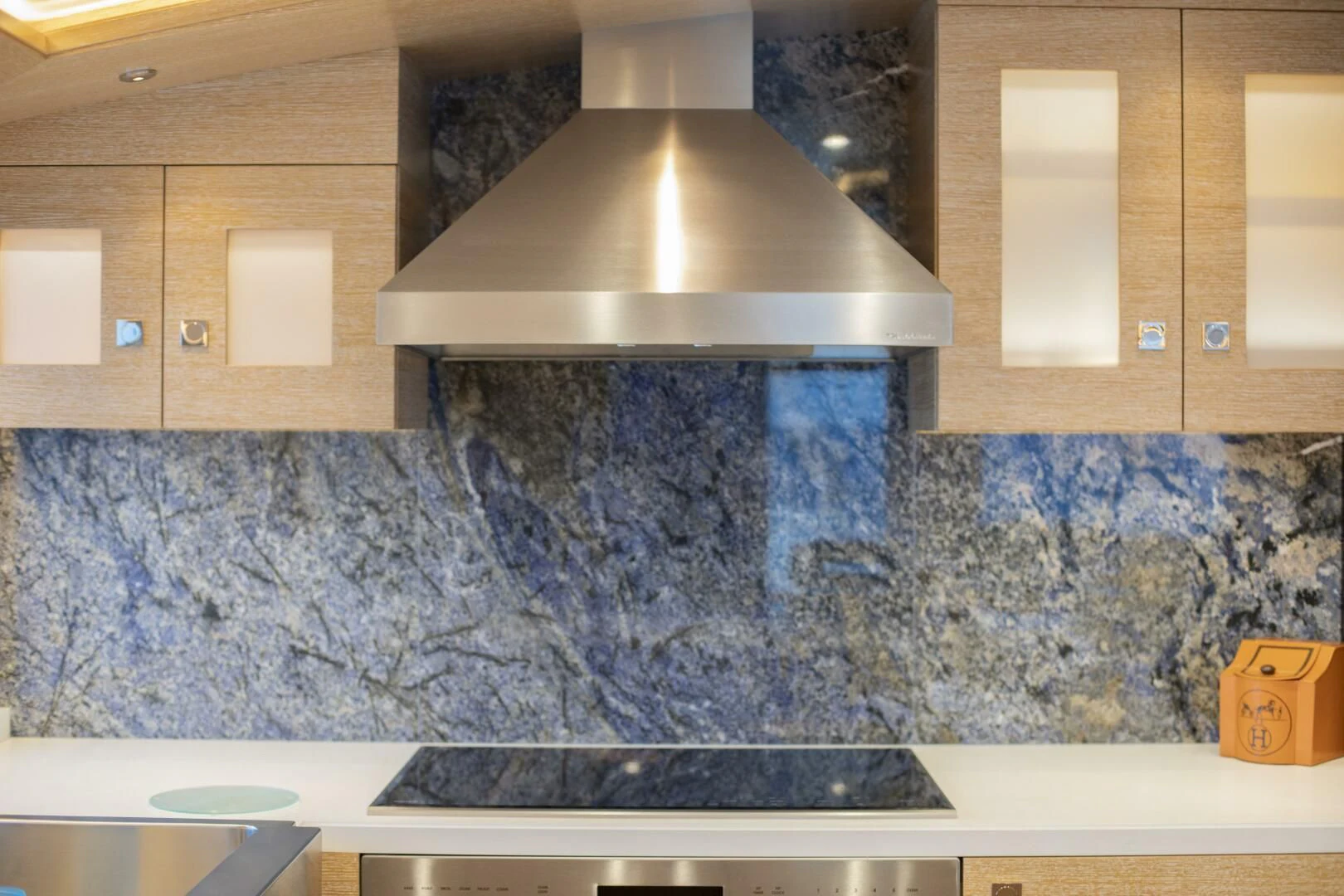 a kitchen with a large stone wall aboard III AMIGOS Yacht for Sale