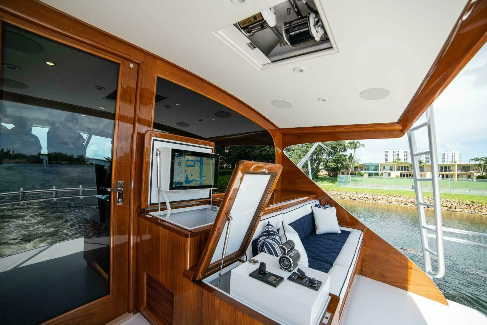 a bedroom with a large window aboard III AMIGOS Yacht for Sale