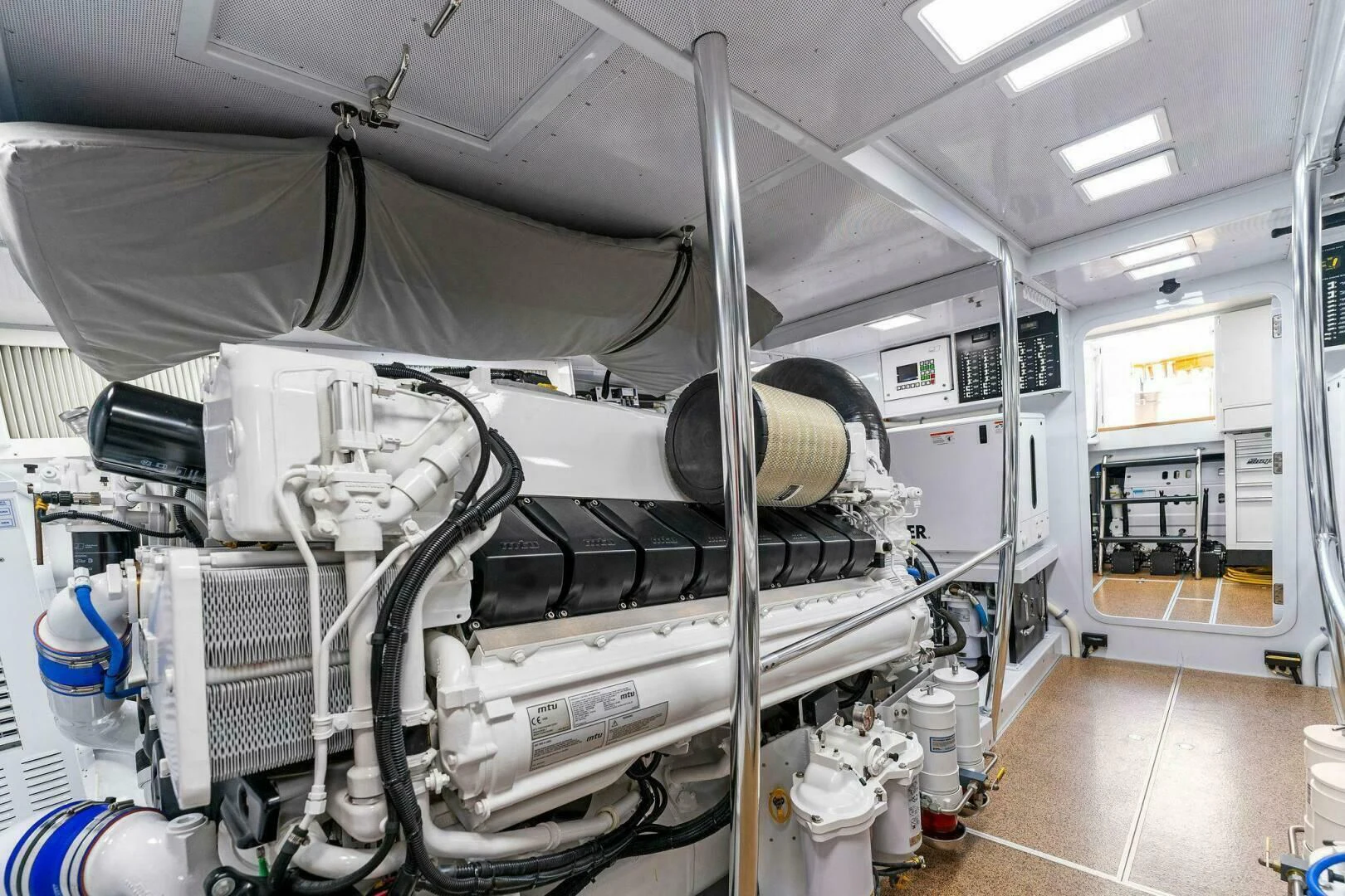 a large white machine aboard III AMIGOS Yacht for Sale