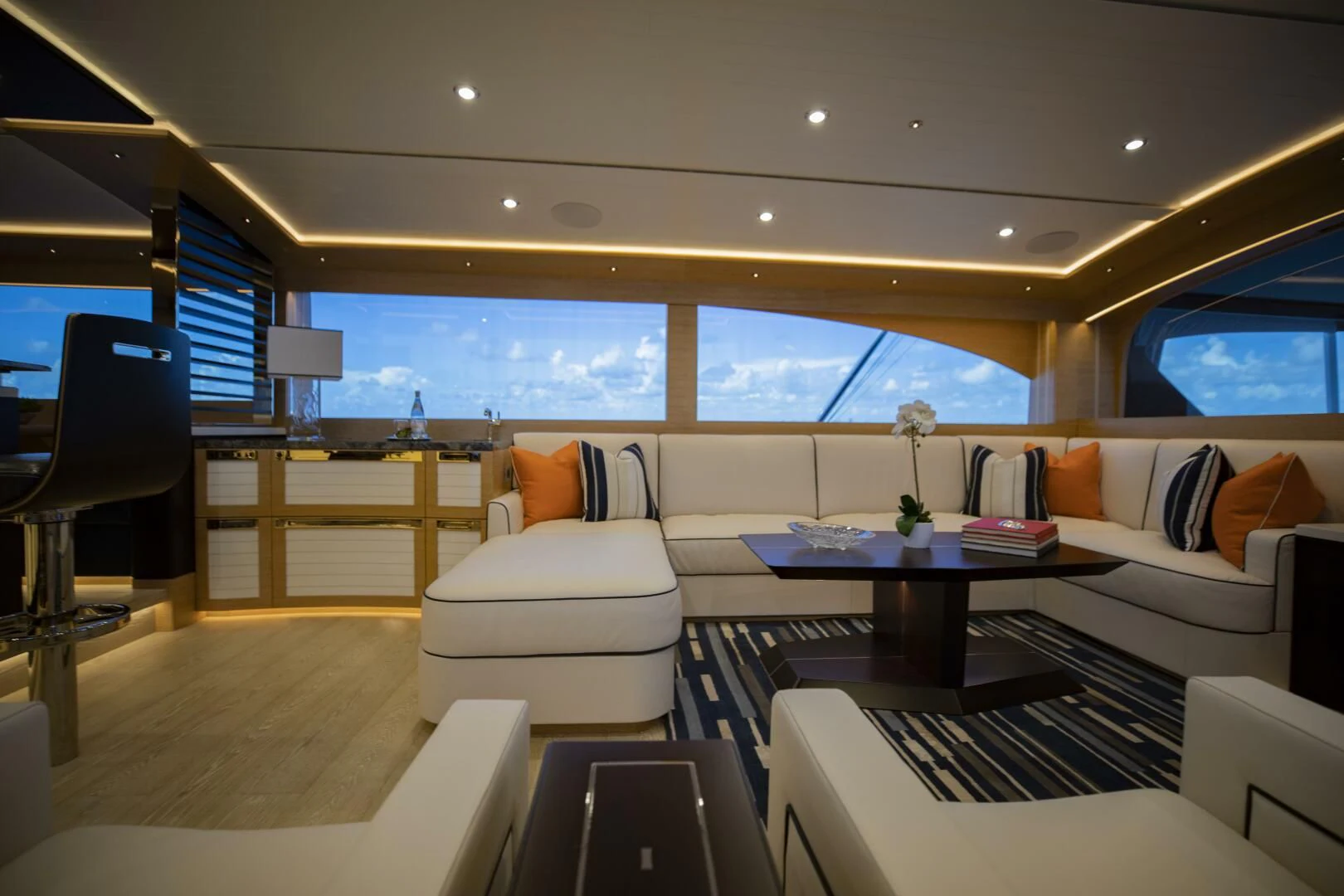 a room with a couch and a table aboard III AMIGOS Yacht for Sale