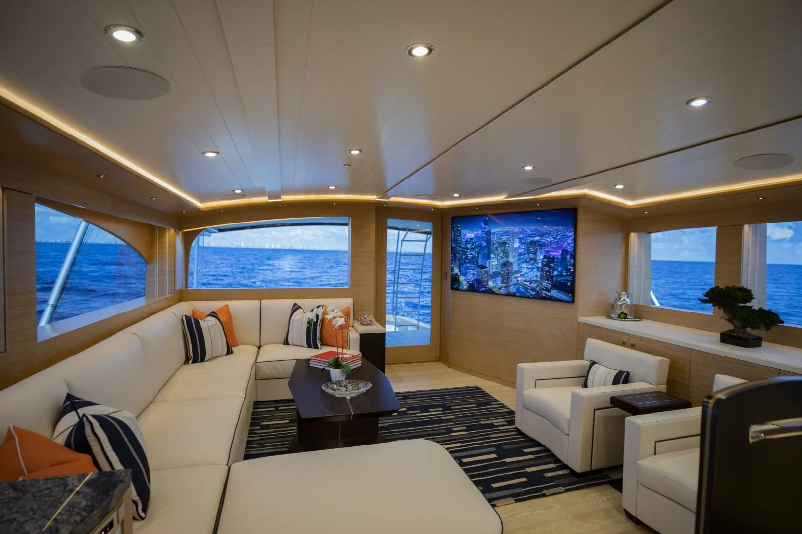 a living room with a large window aboard III AMIGOS Yacht for Sale