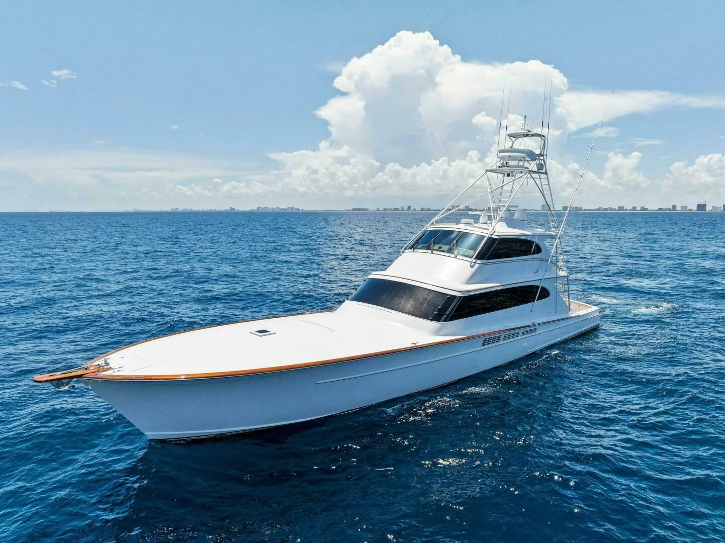 a white boat in the water aboard III AMIGOS Yacht for Sale