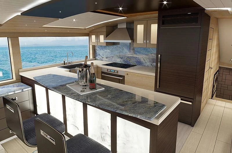 a kitchen with a large island aboard III AMIGOS Yacht for Sale