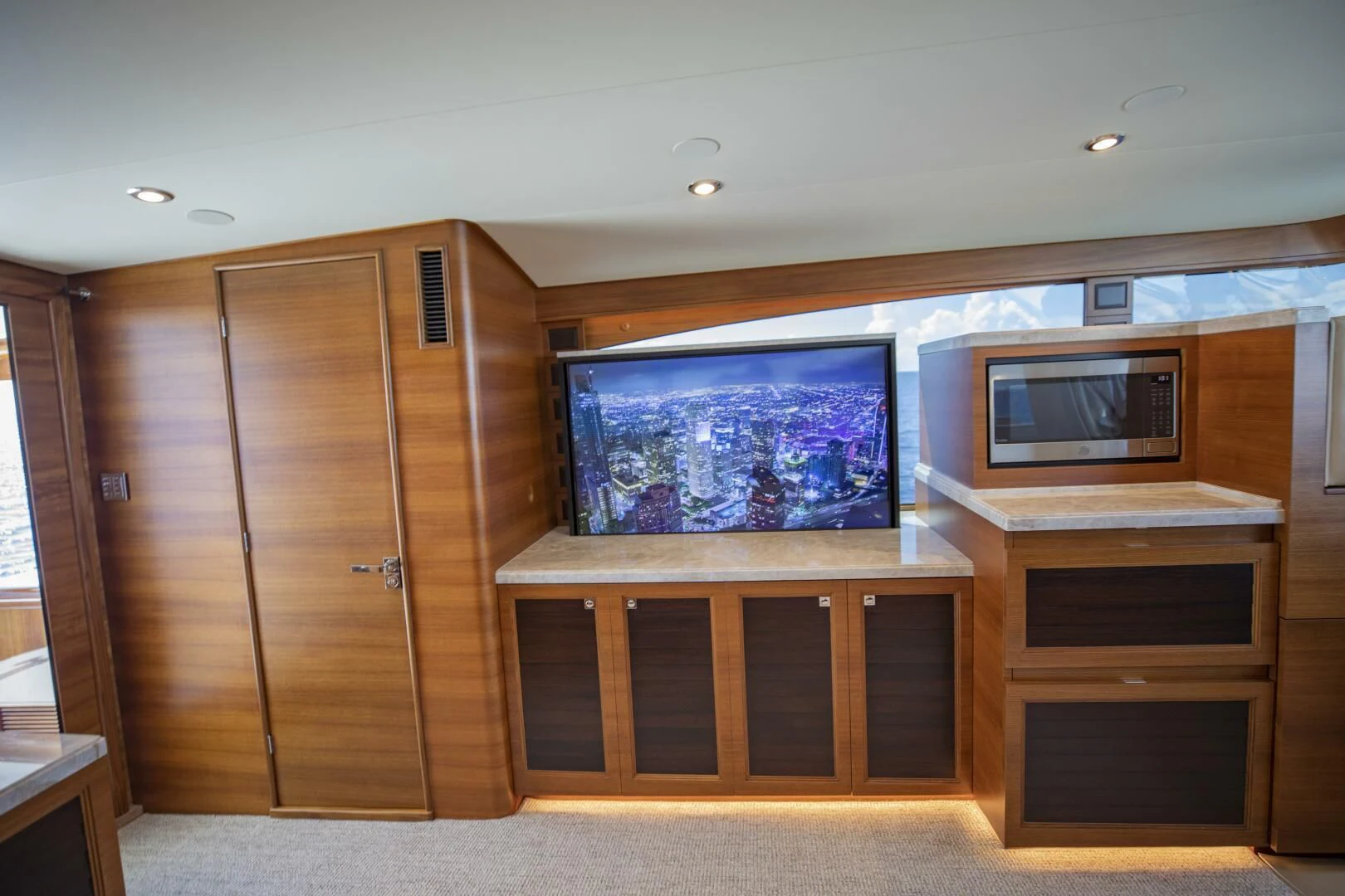 a tv on a cabinet aboard III AMIGOS Yacht for Sale