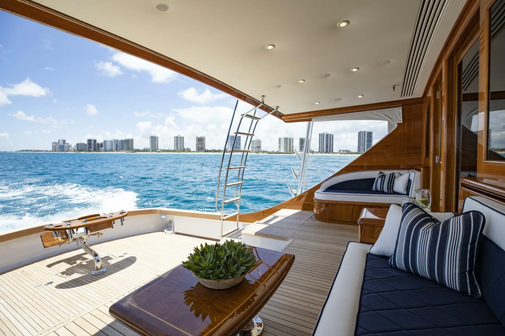 a room with a view of the city and water aboard III AMIGOS Yacht for Sale