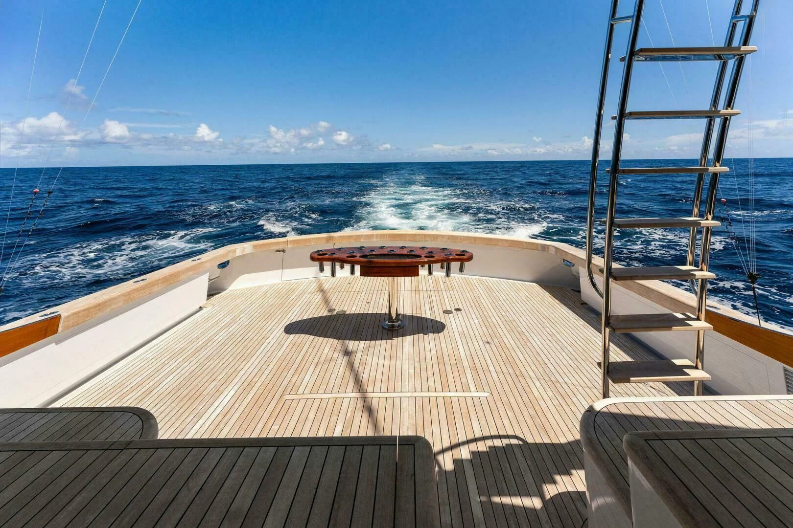 a deck overlooking the ocean aboard III AMIGOS Yacht for Sale