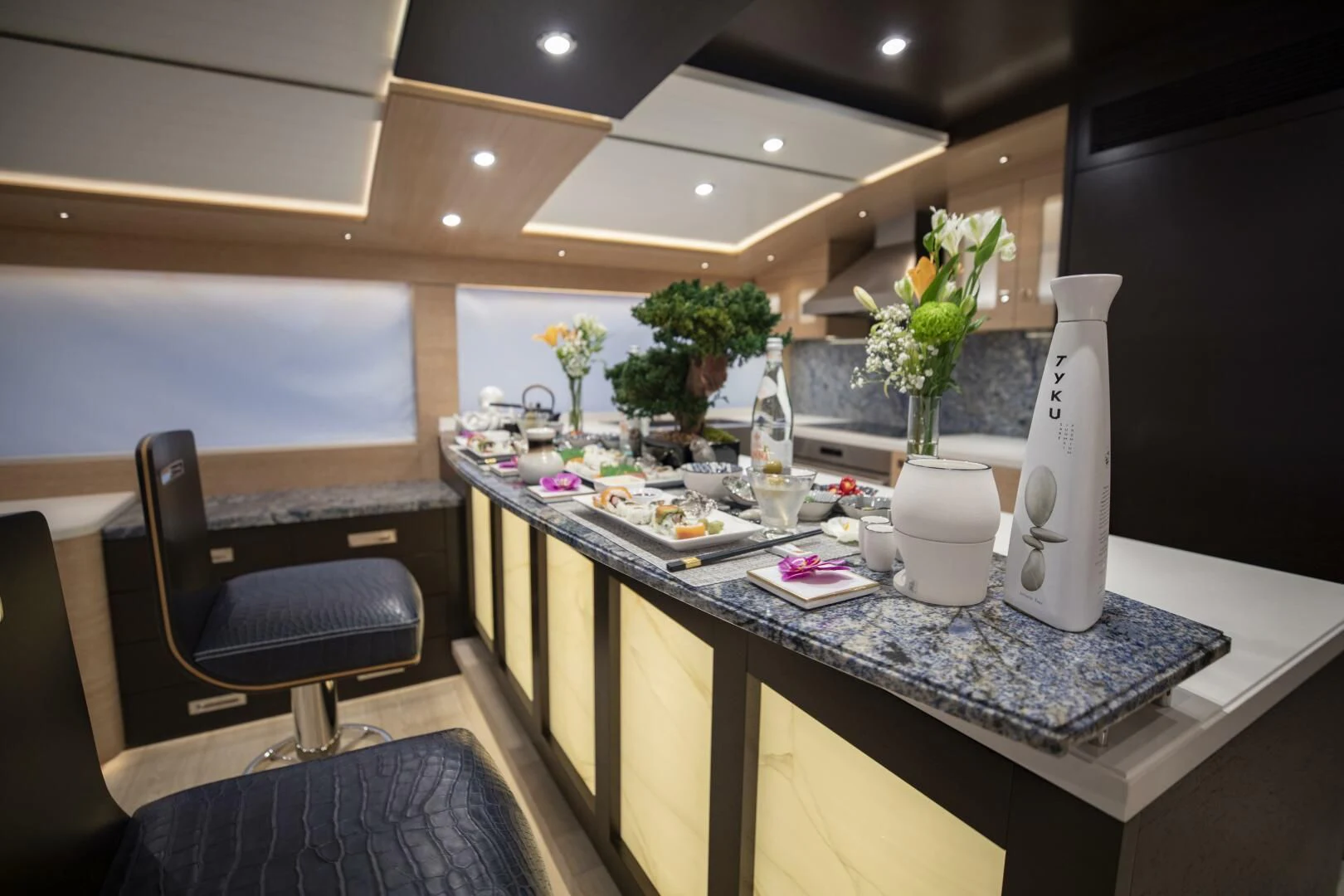 a table with a vase and glasses aboard III AMIGOS Yacht for Sale