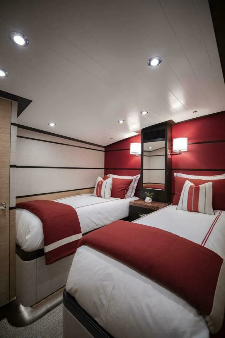 a room with red walls aboard III AMIGOS Yacht for Sale