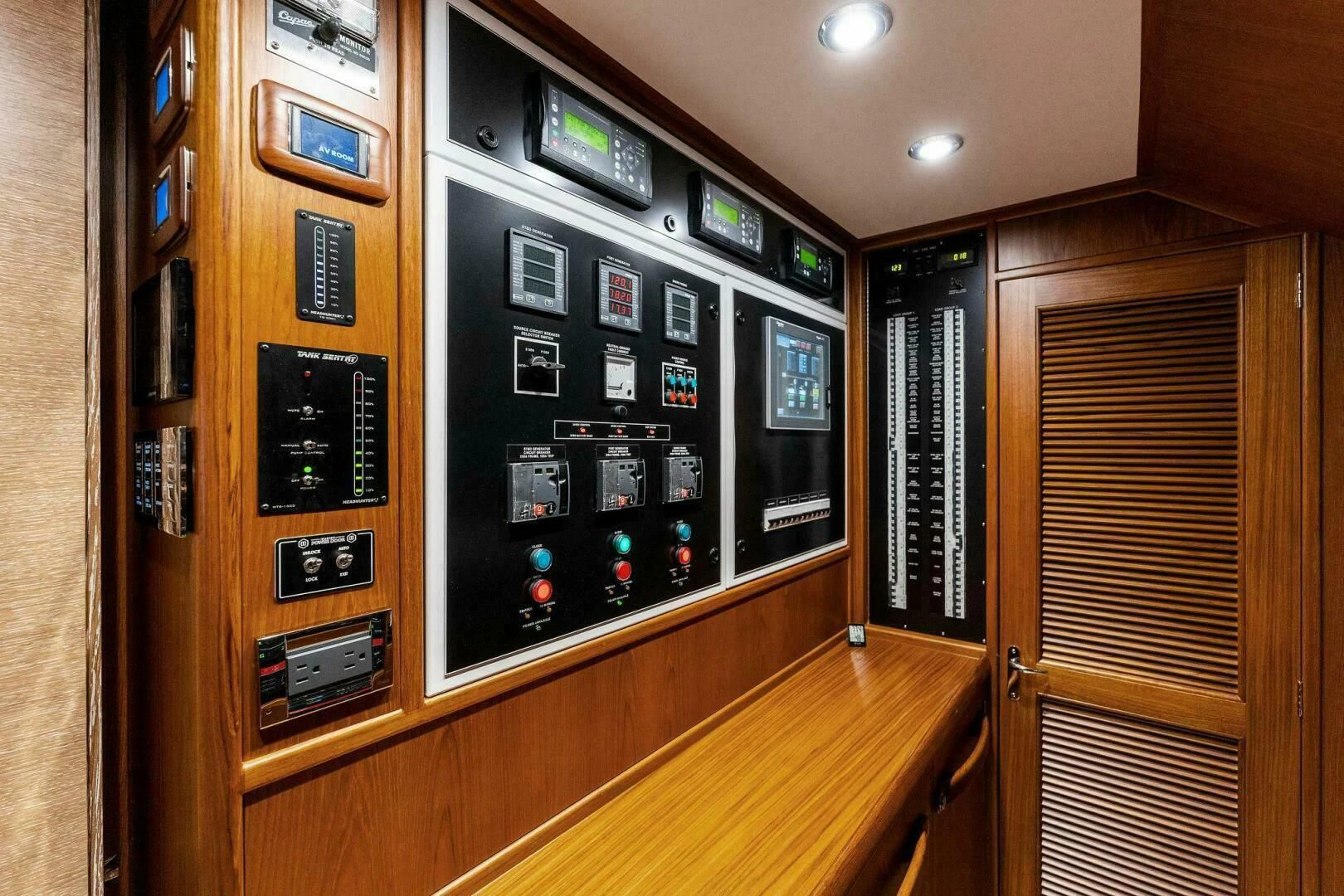 a room with a large computer aboard III AMIGOS Yacht for Sale