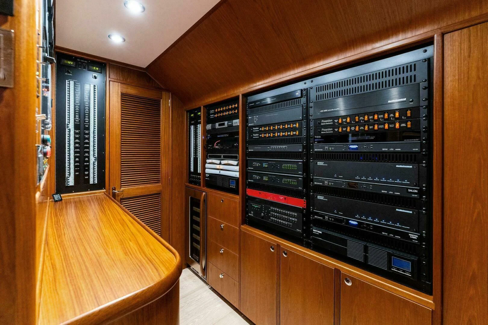 a room with cabinets and a tv aboard III AMIGOS Yacht for Sale