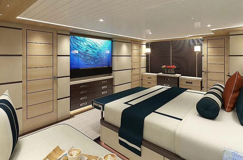 a bedroom with a bed and a tv aboard III AMIGOS Yacht for Sale