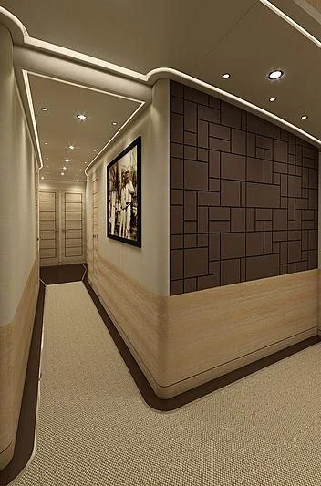 a hallway with a poster on the wall aboard III AMIGOS Yacht for Sale