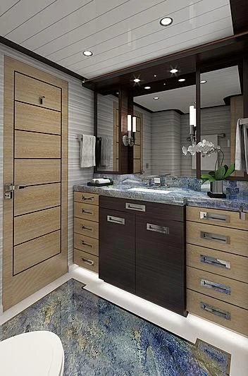 a bathroom with a large mirror aboard III AMIGOS Yacht for Sale