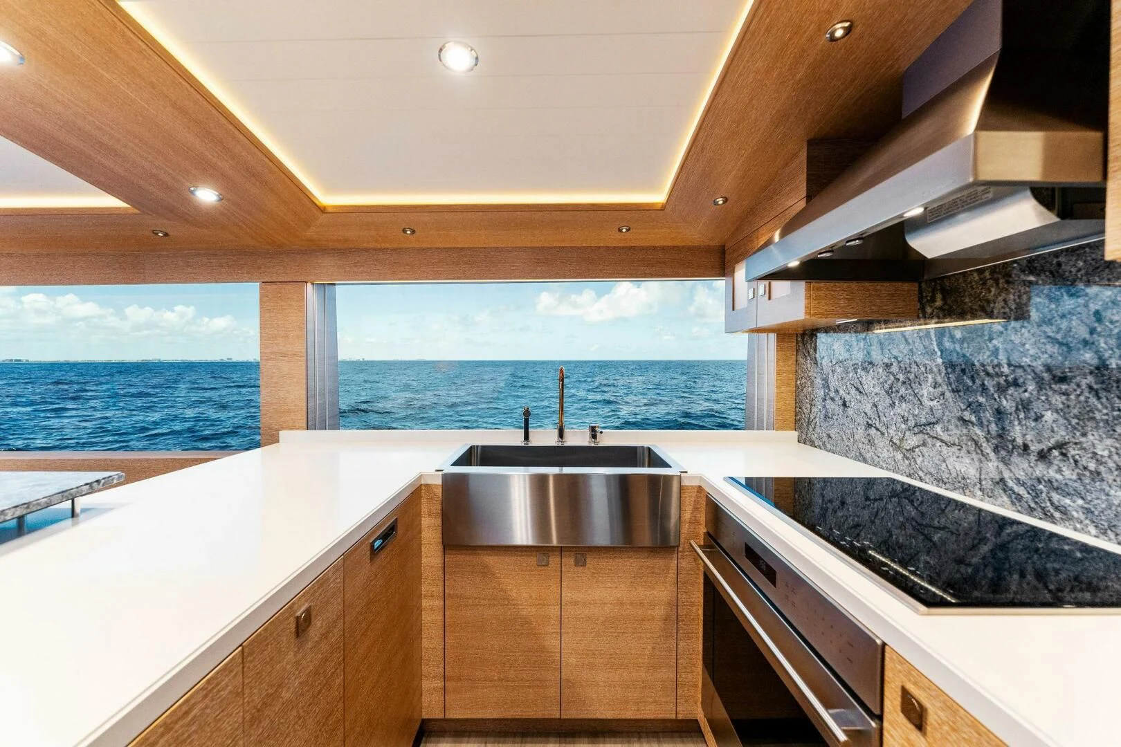 a kitchen with a large island aboard III AMIGOS Yacht for Sale