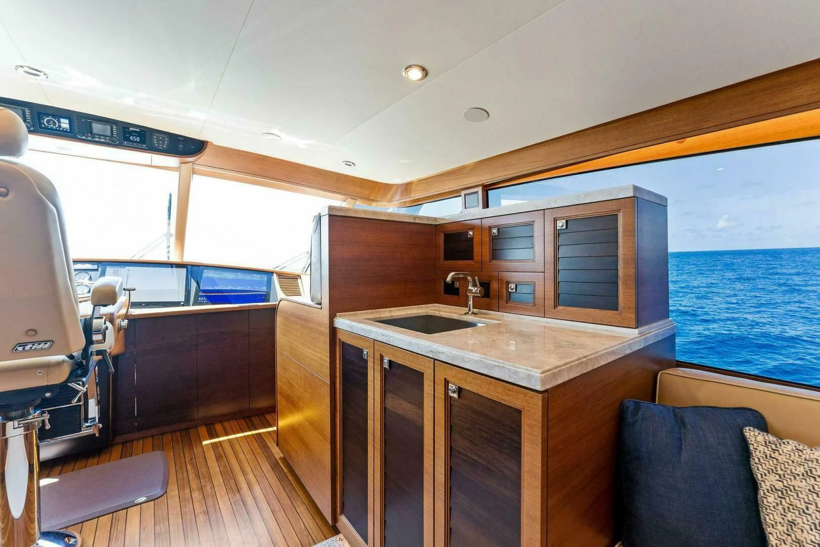 a boat with a sink and a counter aboard III AMIGOS Yacht for Sale