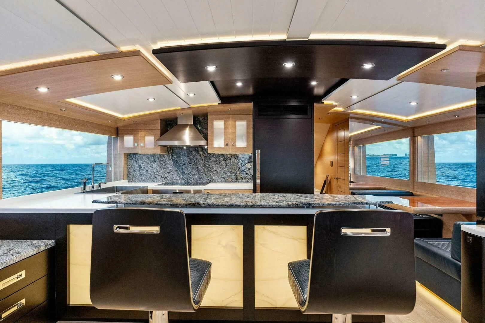 a kitchen with a large island aboard III AMIGOS Yacht for Sale