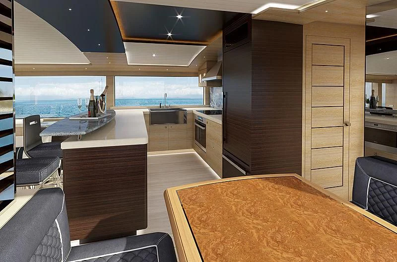 a large kitchen with a table aboard III AMIGOS Yacht for Sale