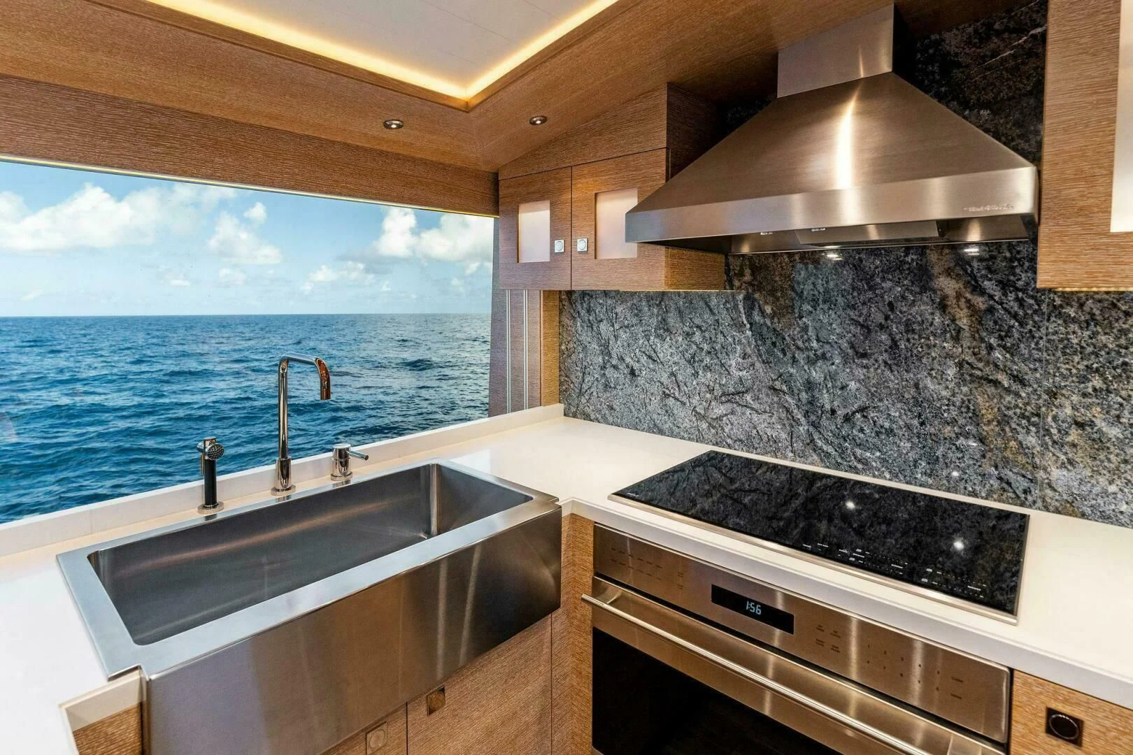 a kitchen with a large window aboard III AMIGOS Yacht for Sale