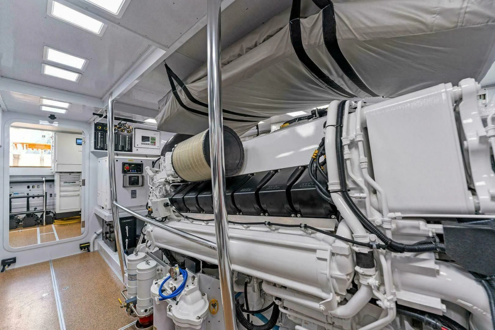 a large machine in a room aboard III AMIGOS Yacht for Sale