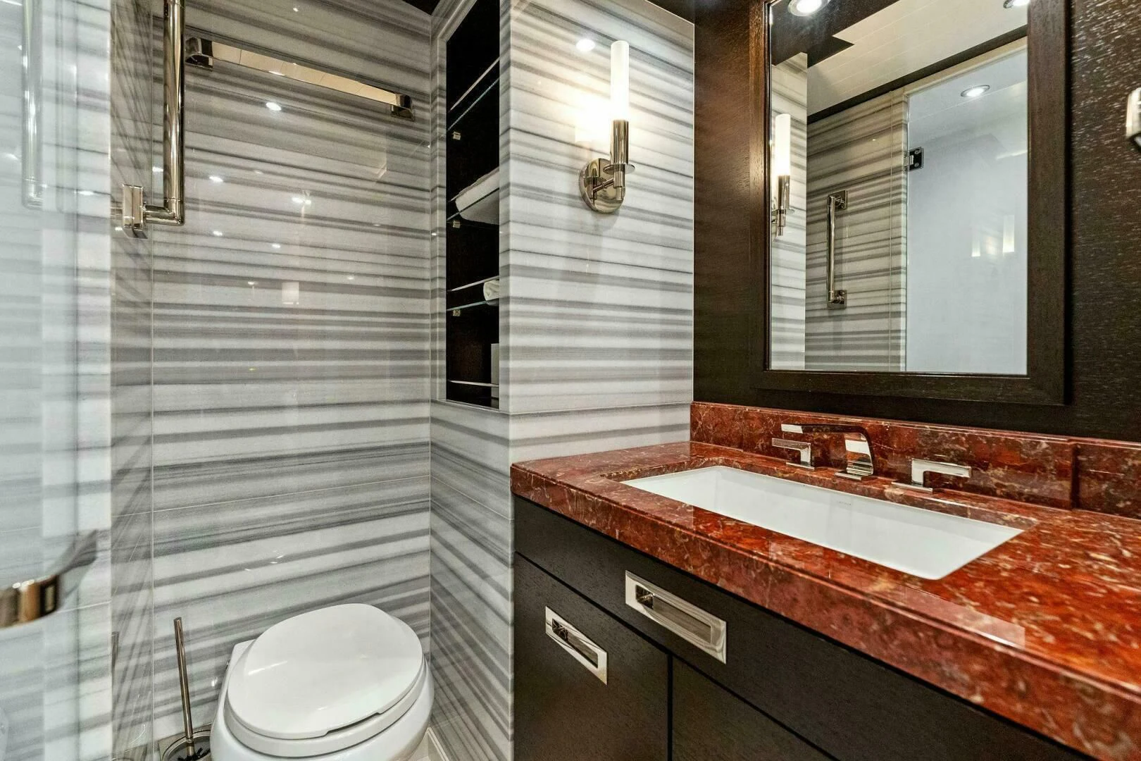 a bathroom with a sink and a mirror aboard III AMIGOS Yacht for Sale