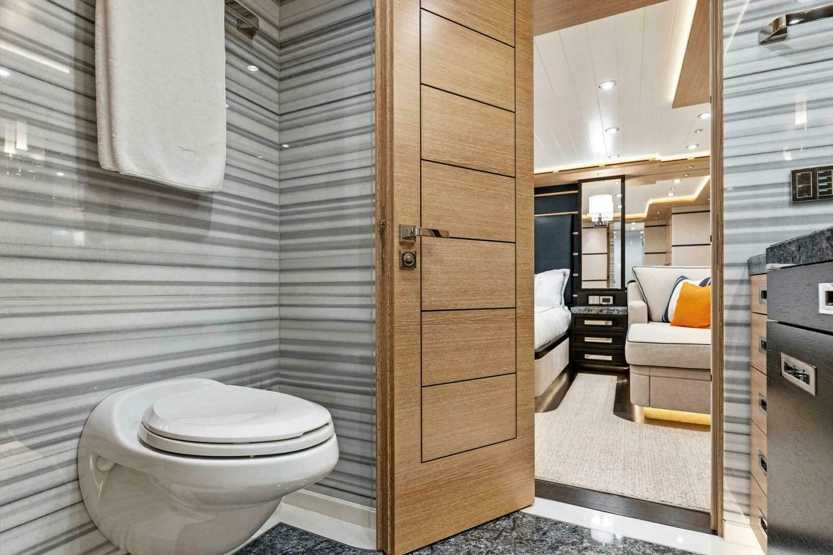 a bathroom with a toilet and a sink aboard III AMIGOS Yacht for Sale