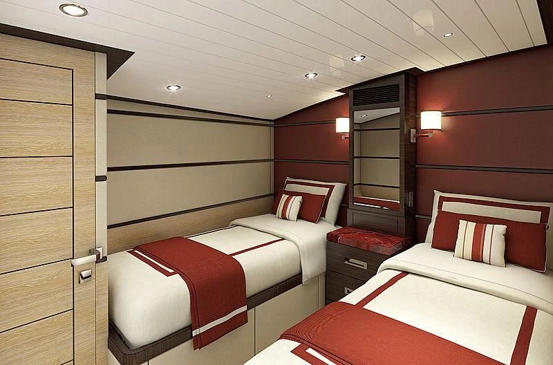 a room with two beds aboard III AMIGOS Yacht for Sale