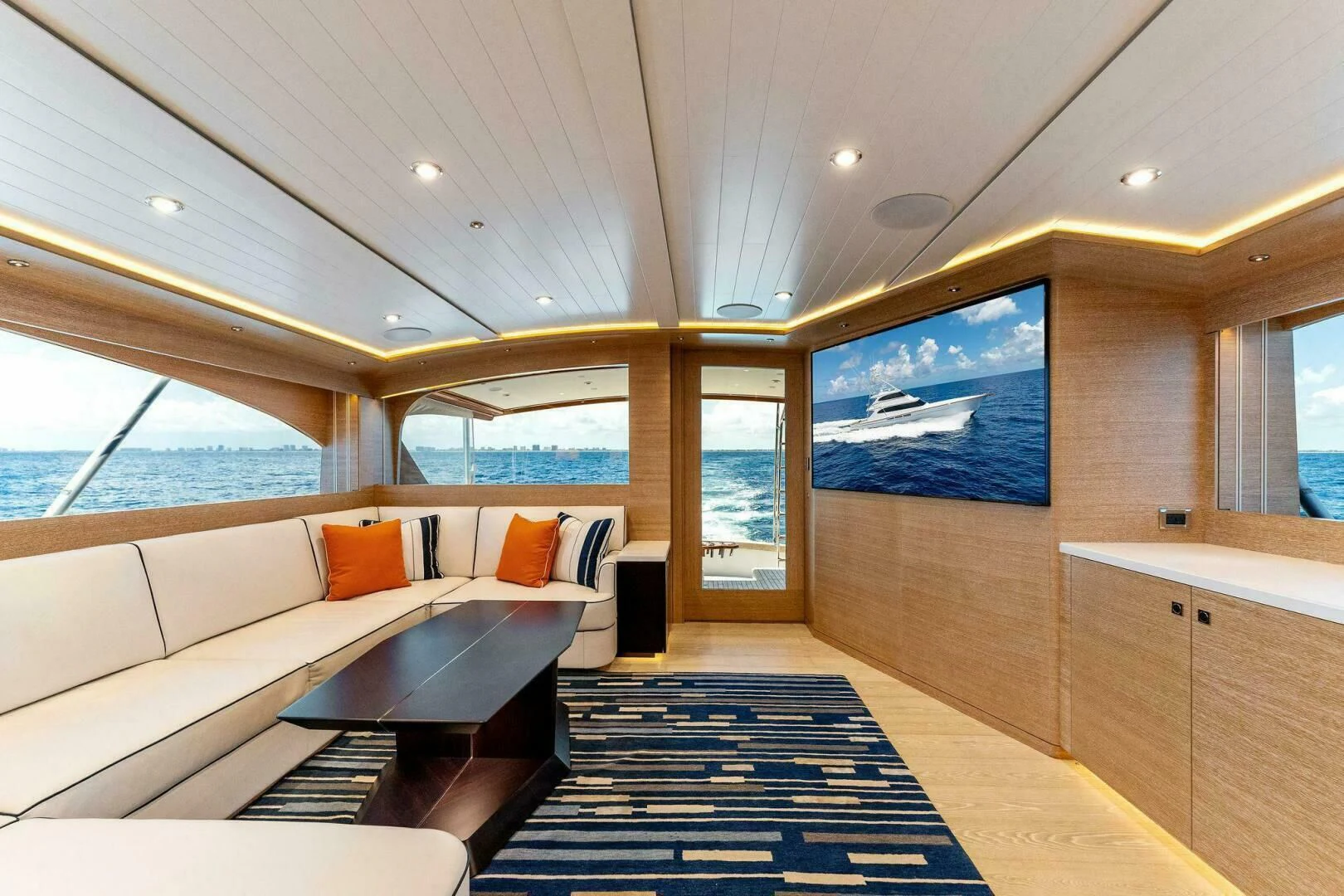 a room with a couch and a table aboard III AMIGOS Yacht for Sale