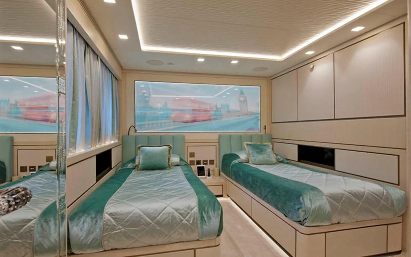 a room with beds and a large window aboard SCORPION Yacht for Charter